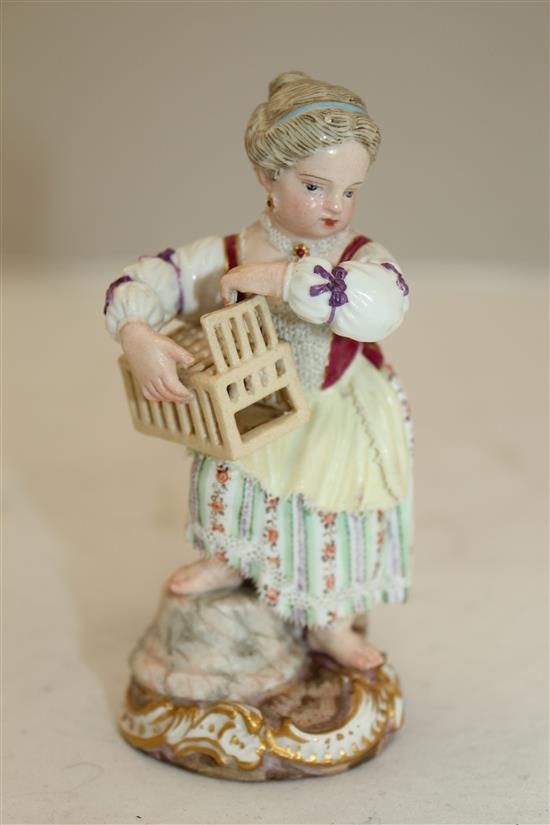 A Meissen figure of girl holding a birdcage, 19th century, 11.5cm